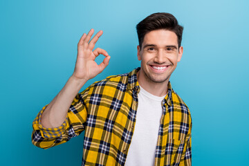 Photo of good mood satisfied cool man with bristle dressed plaid shirt showing okey symbol nice...