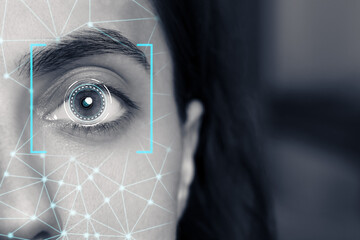 Facial and iris recognition. Woman with digital biometric grid and scan, closeup