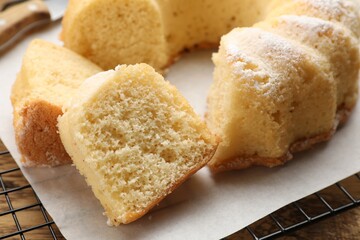 Delicious freshly baked sponge cake on table, closeup