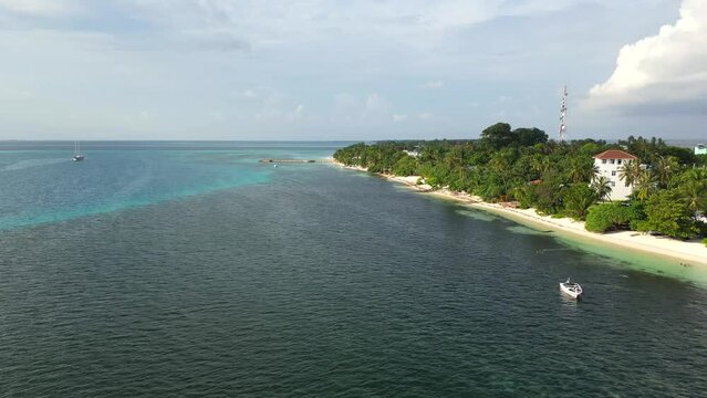 Aerial view of Compass Beach and palm trees at Dhangethi, Maldives, Indian Ocean.