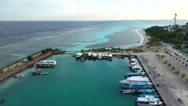 Aerial view of Dhangethi Bridge Harbour including fishing and dive boats, Maldives, Indian Ocean.