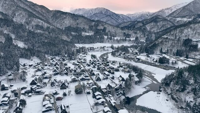 winter in Japan, snowy winter in Japanese mountain valley, aerial view of Shirakawa-go in winter at Christmas, winter holidays in Japan