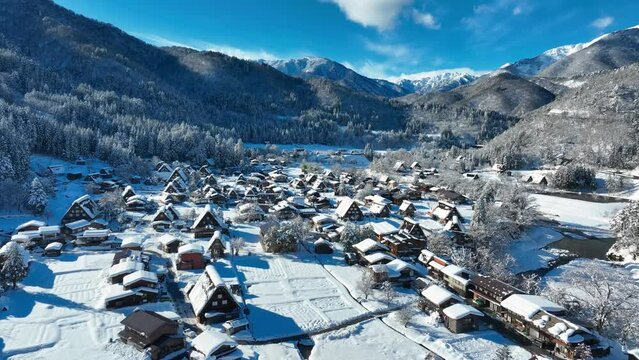 drone view of winter valley in Japan, winter in Shirakawago on a sunny frosty day, scenic UNESCO World Heritage site in Japan in winter