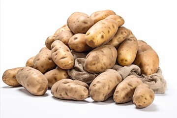 Fototapeta premium Freshly harvested potato tubers with soil isolated on white background. Potato tubers with burlap.