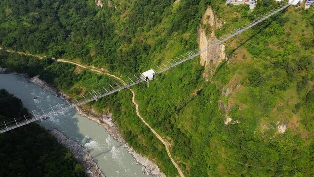 Person bungee jumps off Kushma suspension bridge in Nepal 