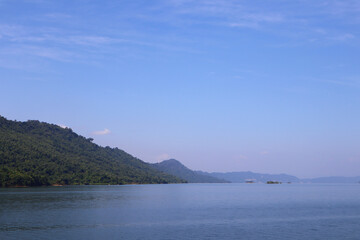 Landscape view of lake and mountains with blue sky in the morning