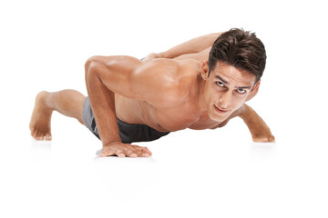Man, portrait and push up or workout in studio, core and cardio exercise for muscle development. Male person, athlete and face by white background, bodybuilding and performance challenge or fitness
