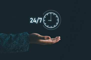 Customer service. nonstop service concept. businessman hand holding virtual 24-7 with clock on hand for worldwide nonstop and full-time available contact of service concept.