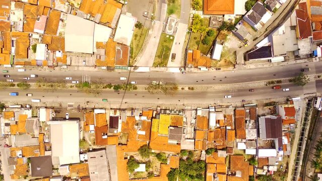 Drone footage of top view of Highway road junctions. Aerial top view urban cityscape timelapse of traffic on the road. Aerial Shot from a flying drone in 4K Resolution