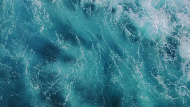 Aerial view of waves crashing in the sea