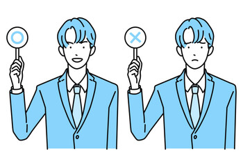 マルとバツの札を持つビジネスマン(男性)