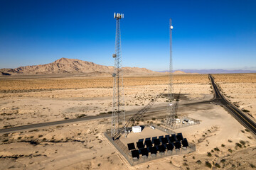 Aerial view of two communication towers in the desert