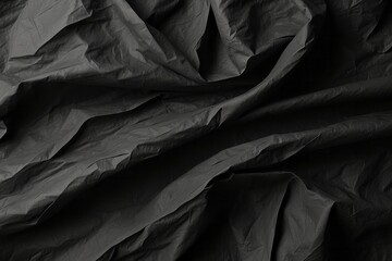 Wrinkled black old wrinkled paper. Dusty cardboard wrapping