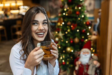 Happy woman, relax in cafe with smile and drinking tea thinking about the future. Remote work...
