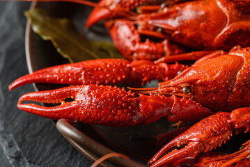 boiled crayfish on a black plate