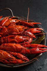 boiled crayfish on a black plate