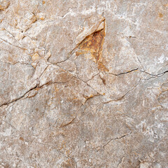 Weathered stone background. Brown rock surface texture.