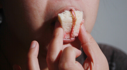 Woman eating cake deliciously
