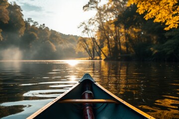Tranquil canoe trip on a calm river with golden sunlight filtering through autumn trees.