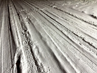 White snow on the road at night