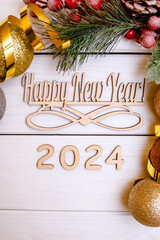 Happy new year 2024 on wooden white background
