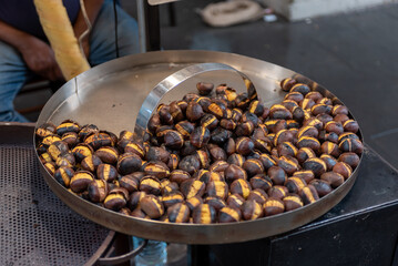 Street Food Made With Roasted Chestnut In Autumn In The Street In Italy