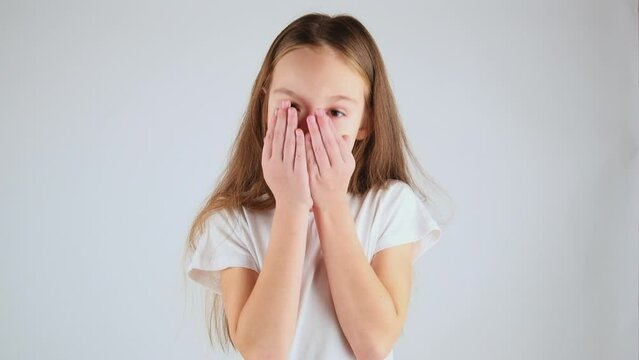 Portrait of unhealthy child girl kid coughing covering mouth with hand, feeling sick, allergy or viral infection symptoms, posing isolated on white background.