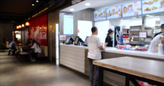 Time Lapse video of People Ordering from the Fast Food restaurant. Blurred background 4K video