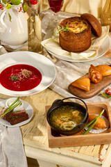 A traditional Slavic soup selection: borscht, fish soup (ukha), and pea soup with smoked meats