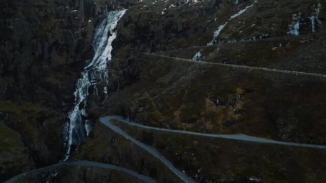 aerial view over trollstigen trolls ladder path road and bridge over stigfossen waterfall in norway mountains