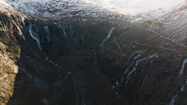 aerial view over trollstigen trolls ladder path road and bridge over stigfossen waterfall in norway mountains