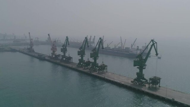 cargo ship in port, harbour in the middle of sea Aerial Drone Footage