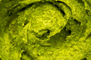 Smoothie with fresh green vegetables and fruits. Berry and yogurt ice cream. The texture of the sorbet. Delicious sweet dessert close-up as a background.