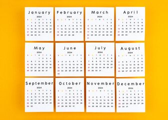 Months 1 to 12 January-December 2024 calendar page on yellow background.