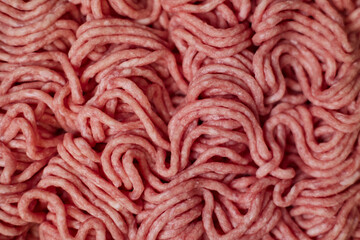 Obraz premium Fresh pork minced meat texture background. Top view of raw pork forcemeat.