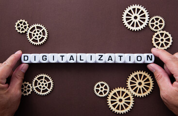 Wooden gears with word Digitalization. Digitalization Concept