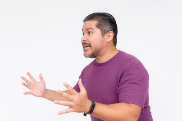 Side view of a stubborn middle aged man looking annoyed while trying to explain his point of view. Wearing a purple waffle shirt. Isolated on a white background.