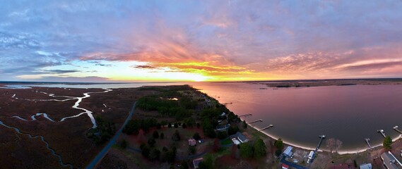 Aerial view of Princess Anne, Maryland with marshlands and waterways at sunset - obrazy, fototapety, plakaty