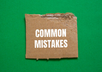 Common mistakes lettering on ripped paper. Conceptual photo.
