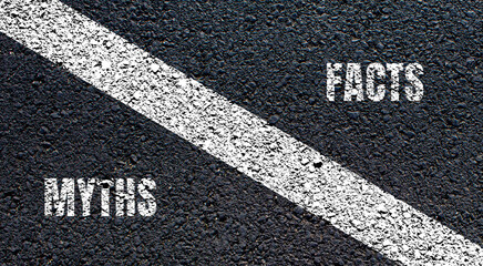 Myths and facts lettering on asphalt road. Conceptual photo.
