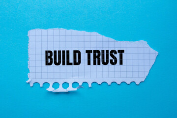 Build trust lettering on ripped paper. Business concept photo.