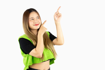 Young asian woman long hair style in green shirt fingers pointing for advertising isolated on white plain background.