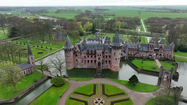 Ascending drone footage of Castle De Haar (Kasteel de Haar) located outside Utrecht, Netherlands