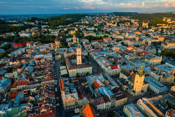 Rooftops of the old town in Lviv in Ukraine. The magical atmosphere of the European city. Landmark, the city hall and the main square. Drone photo.