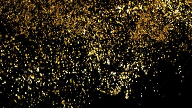 golden glitter particles moving and explosion on black background