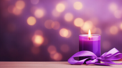 Obraz na płótnie Canvas A candle with purple ribbon on blurred purple background