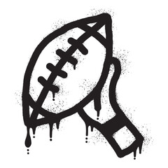 Graffiti of hands holding an American football ball with black spray paint © anakcikal978