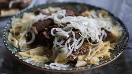 Asian national dish Beshbarmak meat and dough