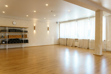 Equipment for yoga and fitness classes. Shelves for storing sports equipment, bags, bars, mats and...