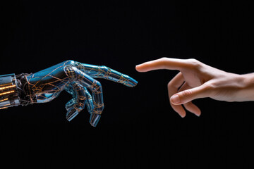 Close-up of robot hand touching human finger isolated on black background